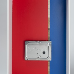 Packaged 24 of n:(ckaged:CZ) : (19.5”x12”x5.5” used hard drive on wood panel)